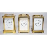Two brass cased carriage timepieces and a brass cased carriage clock, tallest 11.5cms high