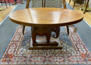 An African oval hardwood elephant occasional table, width 92cm, depth 58cm, height 51cm