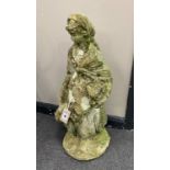A reconstituted stone figural garden ornament, height 63cm