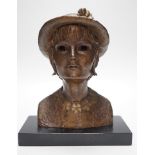 A bronze portrait bust, believed to be film director's wife, Mo Endfield, 27cms high