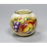 A Royal Worcester spirally moulded globular vase painted with fruits by Roberts, date code for 1955,