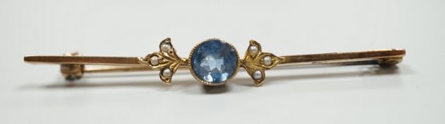 An Edwardian 9ct, aquamarine and seed pearl set bar brooch, 57mm, gross 3.6 grams.