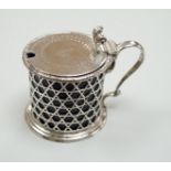 A Victorian pierced silver drum mustard pot by George Fox, London, 1872, with blue glass liner, (