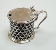 A Victorian pierced silver drum mustard pot by George Fox, London, 1872, with blue glass liner, (