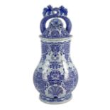 A large Rouen faience blue and white cistern, second quarter 18th century, 57.5cms high painted with