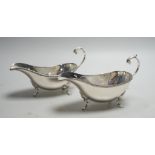 A pair of Elizabeth II silver sauce boats, with flying scroll handles, Poston Products Ltd,