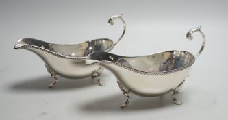 A pair of Elizabeth II silver sauce boats, with flying scroll handles, Poston Products Ltd,