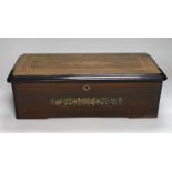 A late 19th century Swiss rosewood and marquetry cased cylinder music box, playing six airs, lacking