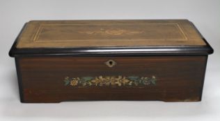 A late 19th century Swiss rosewood and marquetry cased cylinder music box, playing six airs, lacking