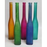 Five bottle neck coloured glass vases, 42cms high
