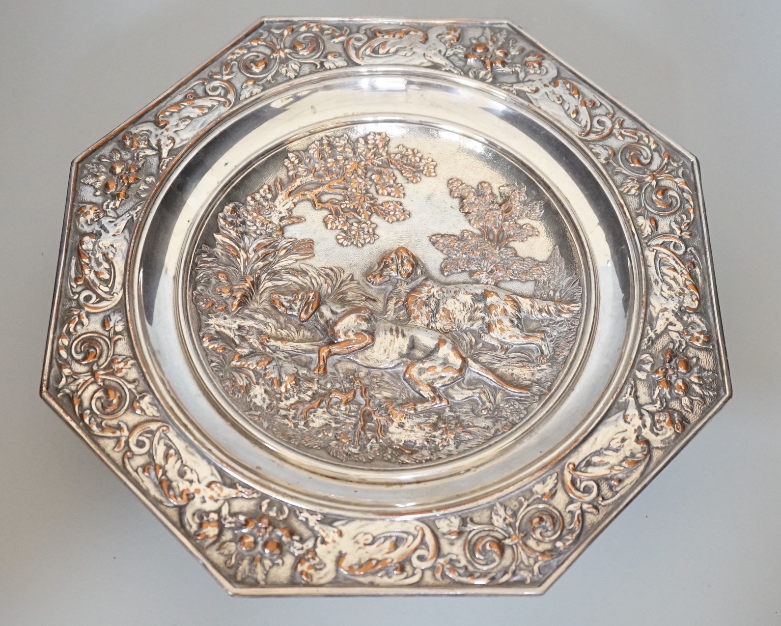 An early 20th century Elkington type silver plated tazza embossed with hunting dogs, 29cm