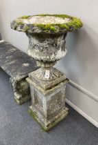 A reconstituted stone campana garden urn on square plinth, diameter 51cm, height 101cm