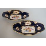 A pair of Royal Worcester blue ground floral painted dishes by E Phillips, signed date code for