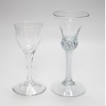 An 18th century air twist stem glass and a facet stemmed glass, tallest 18cms high