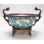 A 19th century French Longwy style ormolu mounted faience bowl on ornate dragon design stand, 23cm