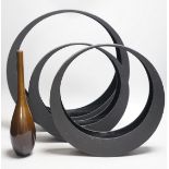 A Japanese bronze bottle vase, 30cm high, three circular black painted wooden abstract sculptures,