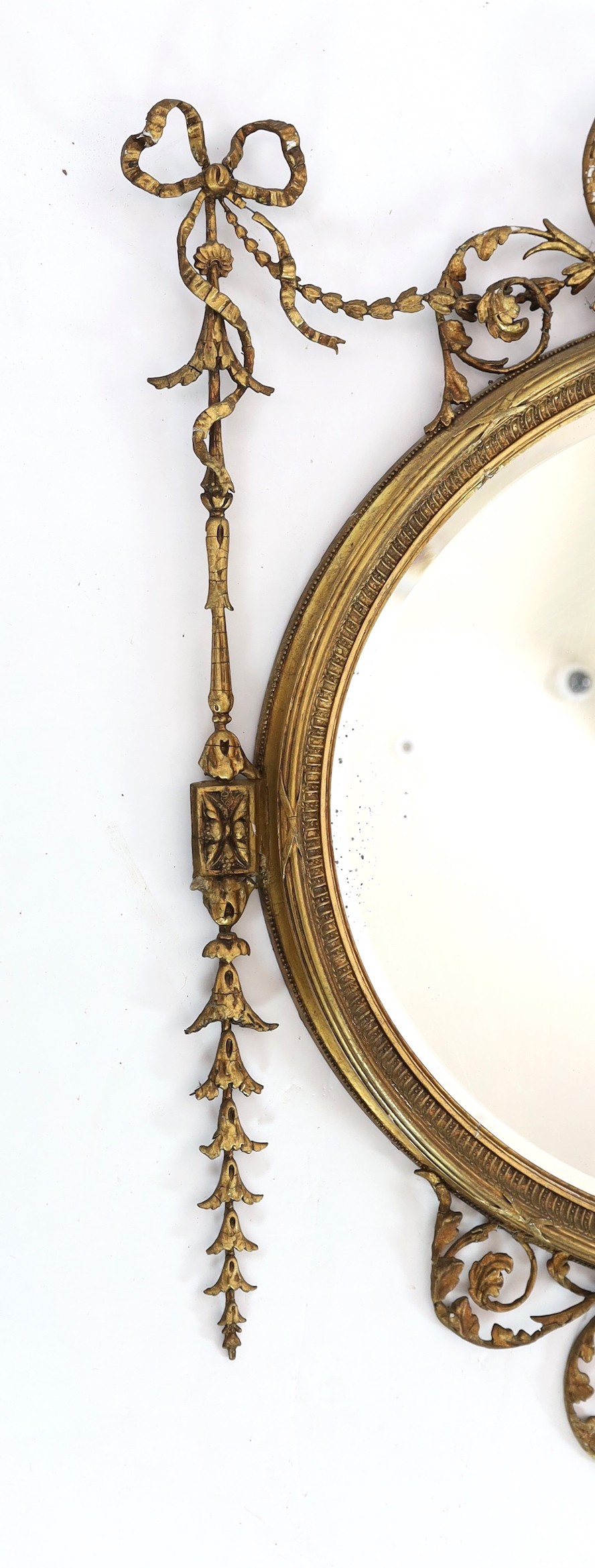 A late Victorian Adam Revival oval wall mirror, with urn, foliate scroll, ribbon and harebell - Image 3 of 6