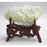 A Chinese bowenite jade carving of a cabbage and a rootwood stand, overall height 24cm