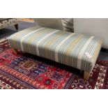 A contemporary rectangular footstool upholstered in Kravet stripe fabric width 117cm, depth 56cm,