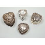 Three Victorian/Edwardian repousse silver heart shaped trinket boxes, largest 56mm and a similar