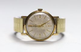 A gentleman's 1950's/1960's 9ct gold Tudor manual wind wrist watch, with baton numerals, and case