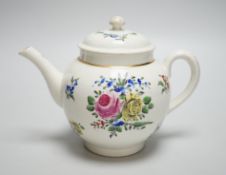An 18th century Caughley teapot and cover with back to back roses, 15cms high