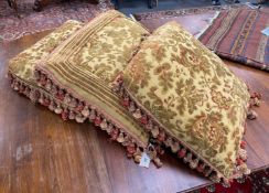 Three square tasselled cushions 56cm