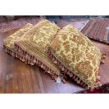 Three square tasselled cushions 56cm