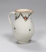 An 18th century Caughley rare factory painted sparrowbeak with a simple floral chain and orange rim.