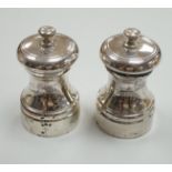 A modern pair of silver salt and pepper mills, Garrard & Co, London, 1984, 76mm.