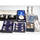 A quantity of mixed silver ware including a pair of modern candlesticks, 15cm, weighted, a cased