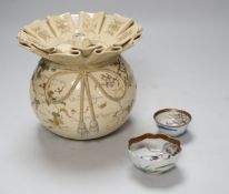 A Japanese Satsuma pottery jar and cover, Meiji period in the form of Daikoku's sack, together