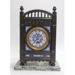 A Victorian Aesthetic Movement ebonised mantel clock in the manner of Walter Crane and Lewis Day.