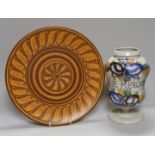 A large Doulton wall plate, model no. D6061 - 34cm diameter and a Dutch Delft drug jar - 26cm tall