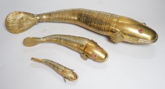 A set of three graduated brass articulated fish, largest 43.3cms long