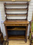 An early Victorian rosewood open bookcase with spiral turned fretwork superstructure, width 92cm,