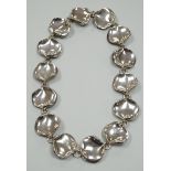 A modern Georg Jensen style silver necklace, with stylised petal links, maker AoL, London, 2008,