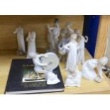 A Lladro collection: seven figures, five further damaged figures and a Lladro reference book