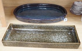 A large Japanese studio pottery oval dish and a larger studio pottery rectangular dish, largest