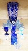 A group of mostly blue glass, largest item engraved vase 32cms high
