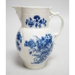 An 18th century Caughley mask jug printed with bouquets, C mark to base, 14.5cms high