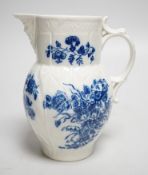 An 18th century Caughley mask jug printed with bouquets, C mark to base, 14.5cms high