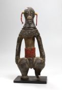 A Benin type cast iron figure. 20.5cm high