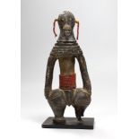 A Benin type cast iron figure. 20.5cm high