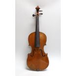 A cased three quarter size violin, labelled E.Coiffier, 56cms long