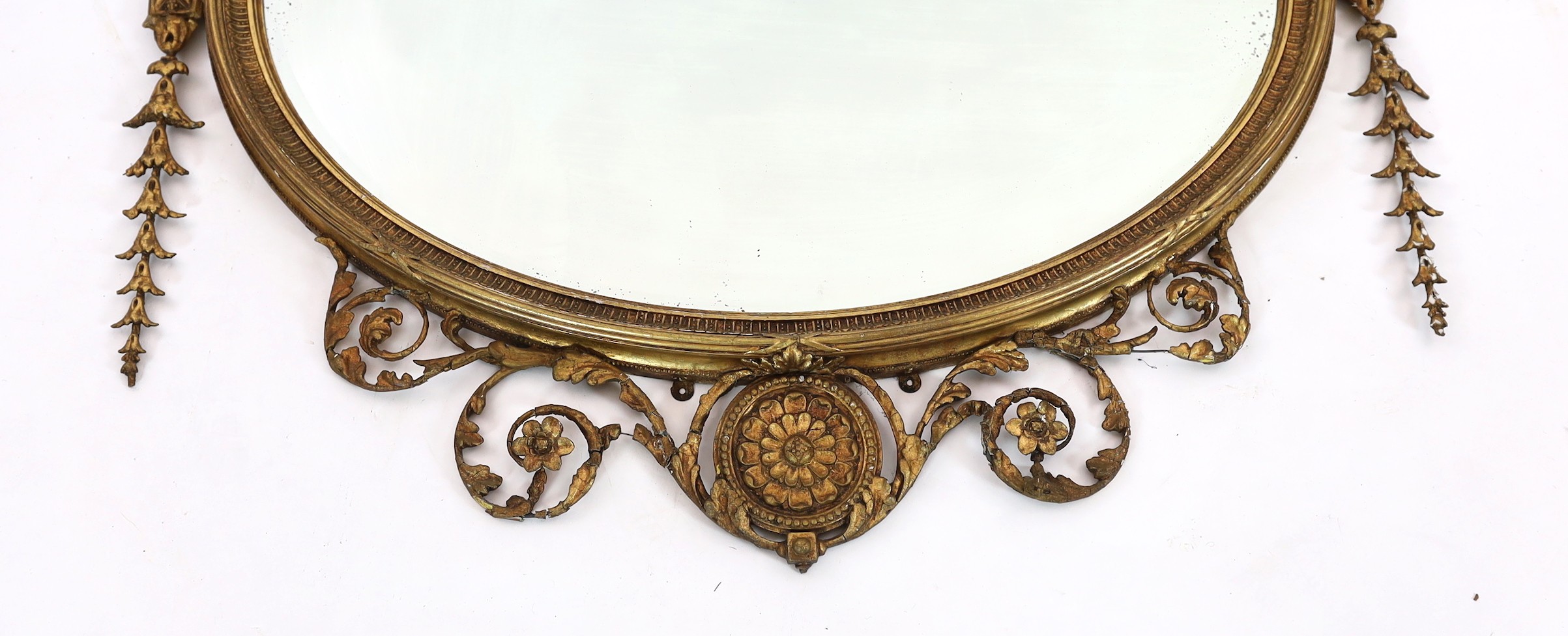 A late Victorian Adam Revival oval wall mirror, with urn, foliate scroll, ribbon and harebell - Image 2 of 6