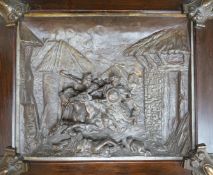 A framed spelter relief plaque, of the Mongols in battle, 59cm wide, 51 cm high, including frame