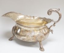 A William IV silver sauceboat, with flying scroll handle, Michael Starkey, London, 1831, length 17.