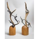 A pair of bronze and antler dancer groups in the style of Edgar Degas, 49cms high