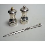 A modern pair of silver mounted salt and pepper mills, boxed, 10.2cm, maker, W.E.V, together with